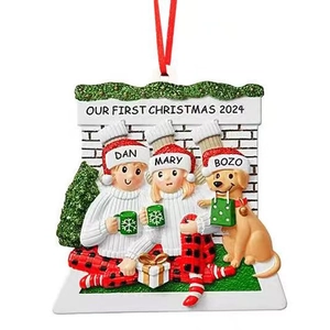 Customized 2024 family Christmas ornament with couple and dog sitting by fireplace