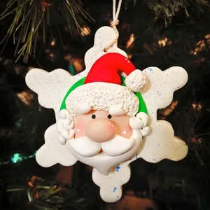 Handcrafted Santa Claus resin ornament with snowflake base on Christmas tree