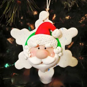 Detailed resin snowflake ornament with Santa Claus face hanging on a Christmas tree