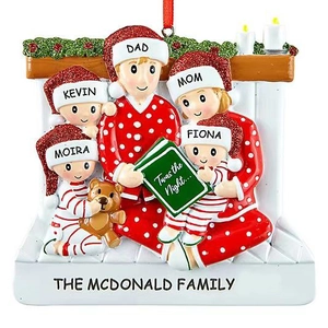 Personalized family of 5 Christmas resin ornament sitting by a fireplace with books