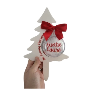 Custom white acrylic Christmas tree ornament with a red bow and feather-filled bauble