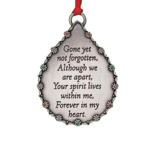 Silver teardrop angel memorial ornament with embossed flowers and festive red ribbon