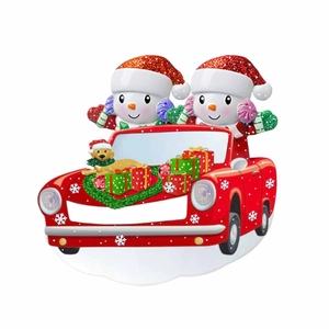 Detailed view of personalized resin car ornament with snowmen and festive dog decoration