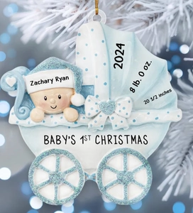 Close-up of a blue personalized baby stroller ornament for baby's first Christmas