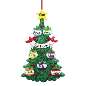 Detailed view of a personalized resin Christmas tree ornament with names and glitter finish