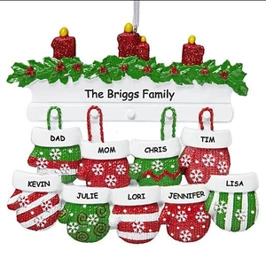 Detailed view of resin Christmas ornament with red candles and nine custom name mittens