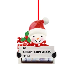 Detail of resin snowman ornament with Christmas hat, gift tag area and red hanging string