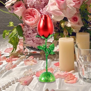 Romantic red rose jewelry box with green leaves on decorative table setting