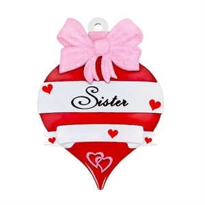 Detail of red heart ornament with pink bow and Sister text for Valentine or Christmas