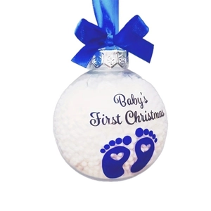 Baby's First Christmas transparent ornament with blue footprints and white foam filler