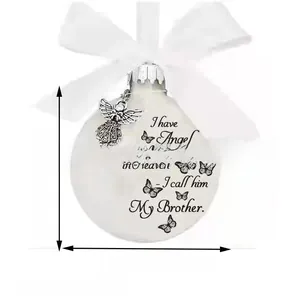 Memorial ornament detail with angel charm and white bow showing 8cm diameter size