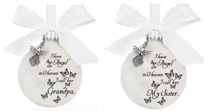 Detailed memorial Christmas ornaments with white ribbon bows and silver angel wing charms