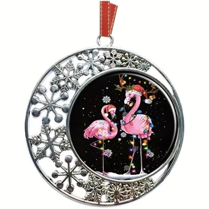 Christmas snowflake metal ornament featuring pink flamingos with festive lights and red ribbon