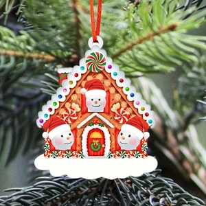 Detail of gingerbread house ornament with snowmen and blank DIY space for names