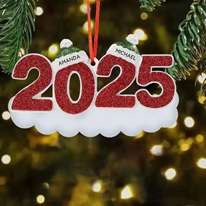 Detail of 2025 resin snowman ornament with custom names on a glowing Christmas tree