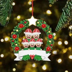 Close-up of resin snowman family wreath with blank banner for custom names