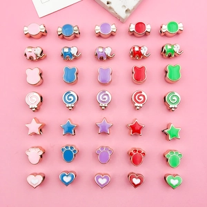 Macro shot of colorful enamel CCB beads in elephant and star shapes for DIY jewelry