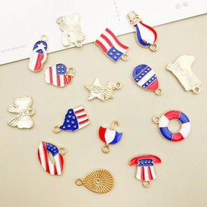 Detail of USA Flag themed alloy pendants with red white and blue enamel drip finish