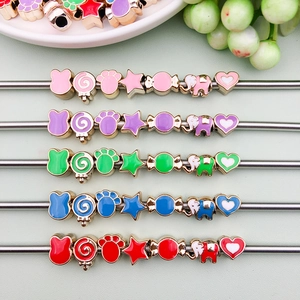 Detailed view of colorful CCB oil-drip animal and candy beads for DIY jewelry making