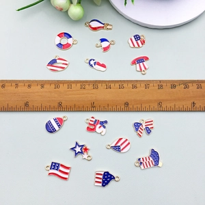 DIY Independence Day charms set with US flag patterns stars and hearts on a ruler background