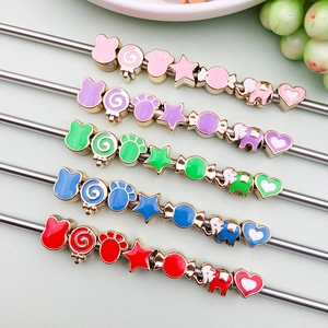 Macro view of colorful drip oil CCB beads in elephant and star shapes for DIY jewelry