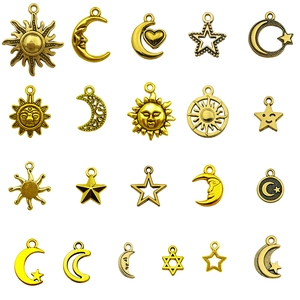 Golden celestial alloy charms featuring sun, moon, and star pendants for DIY jewelry making