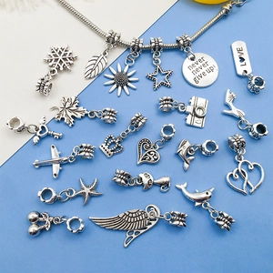 Detailed collection of vintage silver DIY charms including stars, animals and heart shapes