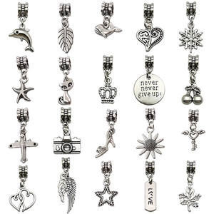 Set of 20 vintage silver alloy charms with various motifs for DIY jewelry making