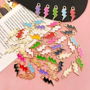 Detailed macro view of colorful enamel lightning bolt charms for DIY jewelry making