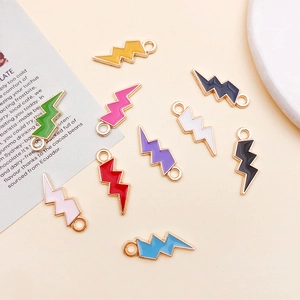 Close-up of lightning bolt alloy pendants in assorted enamel colors for DIY jewelry making