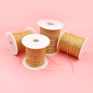 Close-up of four rolls of 18K gold-plated snake chains for DIY jewelry making