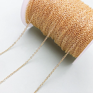 Macro detail of high-quality 18K gold-plated O-link chain roll for DIY jewelry making