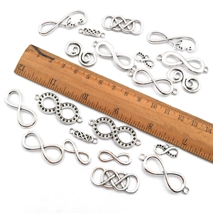 Mixed infinity symbol alloy charms in antique silver finish for DIY jewelry with ruler scale