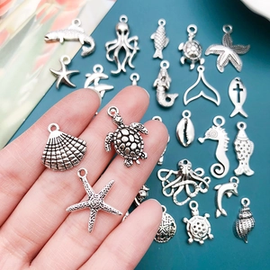 Retro silver ocean themed charms featuring sea turtle, starfish, and shell for DIY jewelry