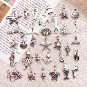 Collection of silver ocean theme charms like starfish and seahorse for DIY jewelry
