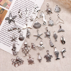 Detailed set of antique silver ocean charms including starfish and turtles for DIY jewelry