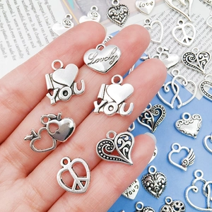 Silver heart charms collection for DIY jewelry making including solid and hollow designs