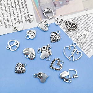 Assorted silver alloy heart charms with intricate engravings for DIY jewelry making