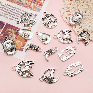 Detail of silver cowboy charms including cowboy boots, hats, and horseshoes for DIY jewelry