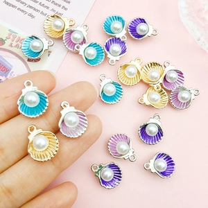 Detailed macro view of colorful shell pendants with pearls for DIY jewelry making