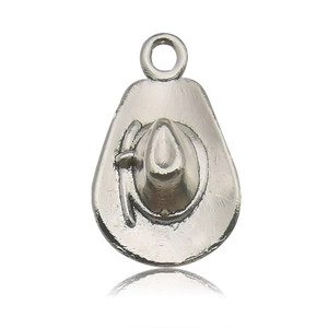 Macro shot of a silver vintage cowboy hat charm with intricate western hatband details