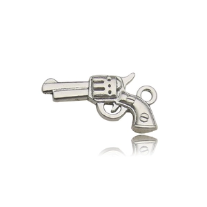 Detailed close-up of a silver vintage revolver charm pendant for DIY jewelry making