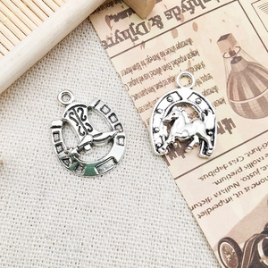 Vintage silver horseshoe charms with horse and cowboy boot designs for DIY jewelry
