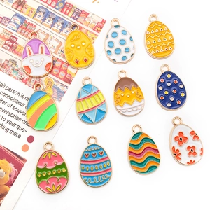 Detail of 11 assorted Easter enamel charms featuring bunny and chick designs for DIY jewelry