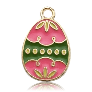 Macro view of Easter egg pendant charm with pink and green enamel and gold leaf details