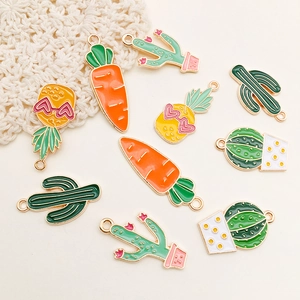Detailed macro view of colorful enamel cactus, carrot, and pineapple DIY alloy charms