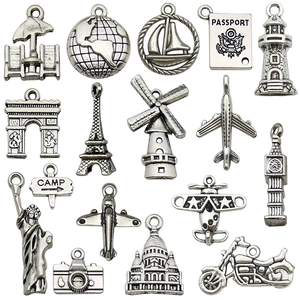 Set of vintage silver travel charms featuring world landmarks and tourist elements