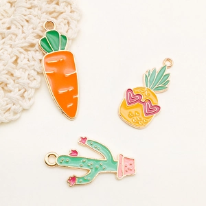 Detailed view of colorful alloy carrot, pineapple, and cactus charms for DIY jewelry making