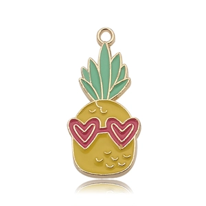 Close-up of cute pineapple pendant with red heart sunglasses for DIY jewelry making