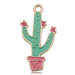 Macro detail of enamel cactus pendant with pink flower and golden hanging ring charm